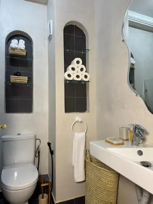 a bathroom with a toilet and a sink at Yaqcha Home in Casablanca