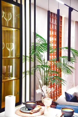 a table with plates and a plant in a room at Le Sublime in Casablanca