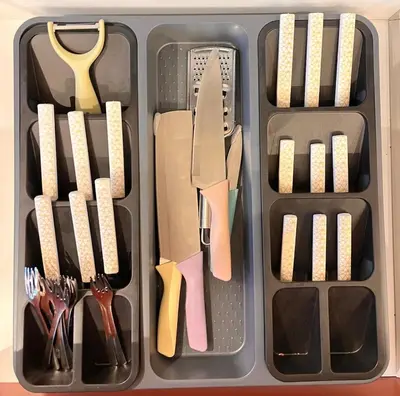 a plastic container filled with utensils and spatulas at Chic, well-equipped apartment in a perfect location in Temara