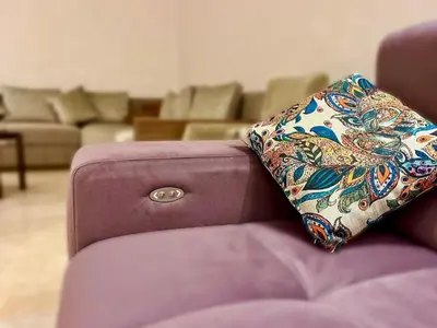 a pillow sitting on the back of a couch at Chic, well-equipped apartment in a perfect location in Temara