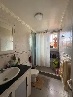 a bathroom with a sink and a toilet and a shower at Summer sale two bedroom APT Near downtown in Casablanca
