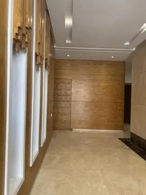 a hallway with wood paneled walls and a hallway with a hallway at Petit bijou à Hay Riad in Rabat