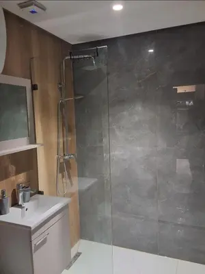 a bathroom with a shower and a sink at Bsmilah in Rabat