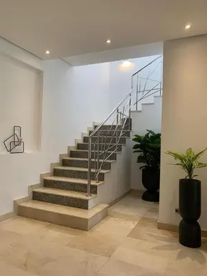 a staircase in a room with a stair case at Villa Moderne et élégante Piscine Golf Resort in Casablanca