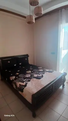 a large bed in a room with at Résidence yassine in Rabat