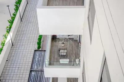 an overhead view of a balcony of a building at VIVASTAY Casablanca - Ocean Park Sunset Escape beach front with swimming pool in Aïn Harrouda
