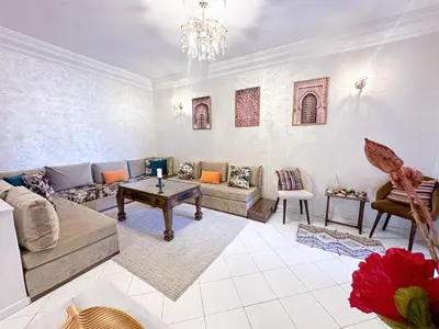 a living room with a couch and a table at Horizon bleu in Rabat