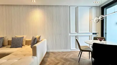 a living room with a couch and a table at Urban Apartment 2 Mars - By AppartAli in Casablanca