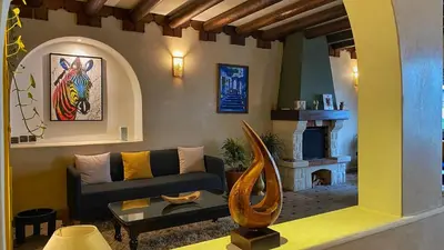 a living room with a couch and a fireplace at Marrakech atmosphere in Casablanca in Casablanca