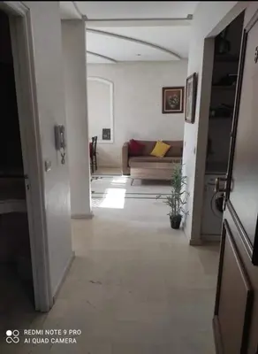 a living room with a couch and a table at اقامة فال دانفا in Casablanca