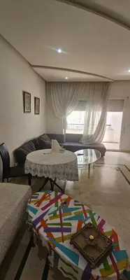 a living room with a couch and a table at اقامة فال دانفا in Casablanca
