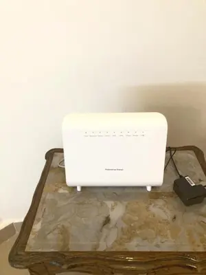 a white router sitting on top of a table at Serenity in Rabat's downtown in Rabat