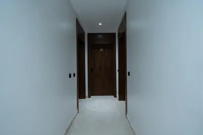an empty corridor with a door in a room at Terracotta Chic Studio Cosy Les Princesses Casablanca in Casablanca