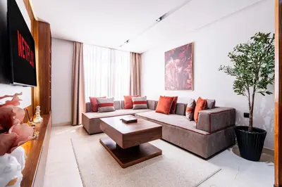 a living room with a couch and a table at Terracotta Chic Studio Cosy Les Princesses Casablanca in Casablanca