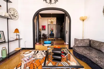 a living room with a couch and a table at Assayag Art Deco - 1930 in Casablanca
