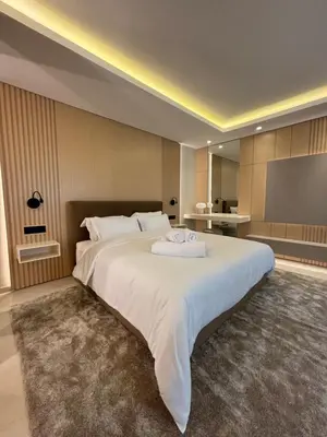 a bedroom with a large white bed in a room at LabelCapitale in Rabat