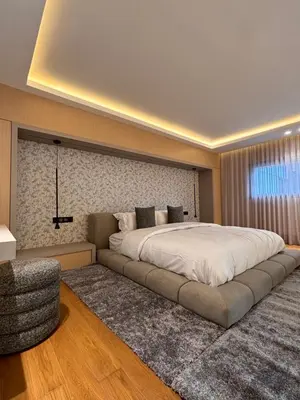 a bedroom with a large bed with a large white blanket at LabelCapitale in Rabat