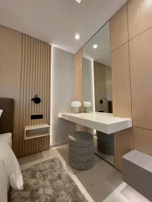 a bedroom with a large mirror and a white desk at LabelCapitale in Rabat