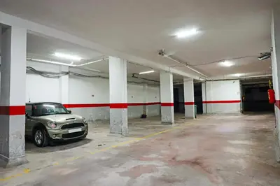 a parking garage with a car parked in it at Lagoon Garden - 2 chambres proche Plage avec Piscine in Skhirat