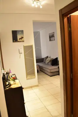 a living room with a mirror and a couch at Havre de paix appartement in Mohammedia