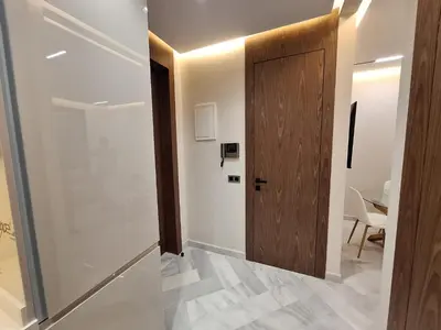 a bathroom with a wooden door and a table at Appartement to stay in Casablanca, CfC in Casablanca