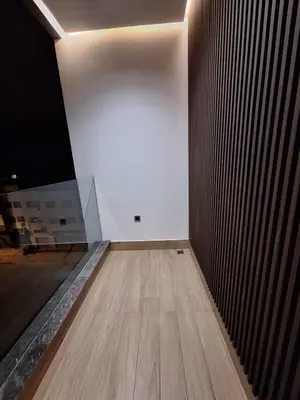 a room with a wooden floor and a white wall at Appartement to stay in Casablanca, CfC in Casablanca