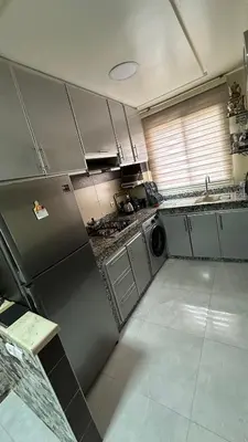 a kitchen with a stainless steel refrigerator and a dishwasher at Tamaris in Casablanca