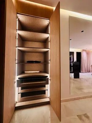 a dressing room with a mirror and a closet at Cozy Studio Steps from Med V Stadium in Casablanca