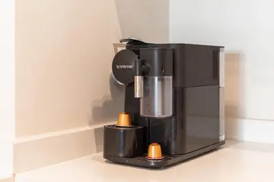a black coffee maker sitting on a counter at L'Horizon - 1 BR - Pool & Terrace in Nouaseur