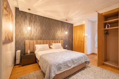 a bedroom with a large bed in a room at Marina Vacation Homes in Casablanca