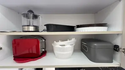 a shelf with various kitchen items on it at Between sea and historic center in Rabat