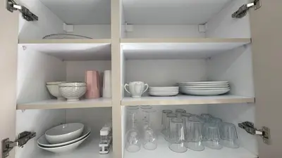 a cabinet filled with plates and bowls and dishes at Between sea and historic center in Rabat