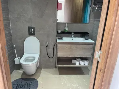 a small bathroom with a toilet and a sink at Solstice 73 Luffy Air Studio in Casablanca