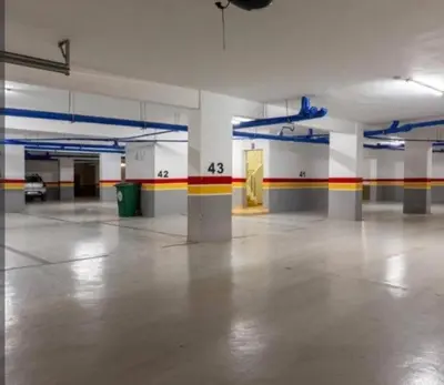 an empty parking garage with a room with colorful walls at Appartement tamaris les crêtes in Casablanca
