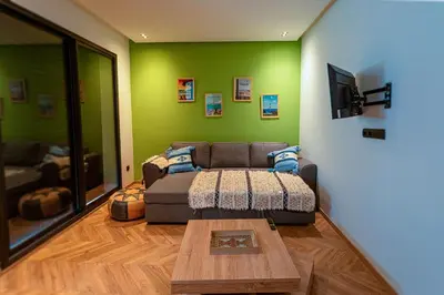 a living room with a couch and a coffee table at Graffiti Chill Zone - Calme en plein Centre in Casablanca