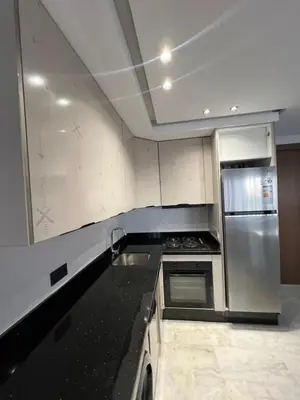 a kitchen with a stove and a refrigerator at studio in Maarif