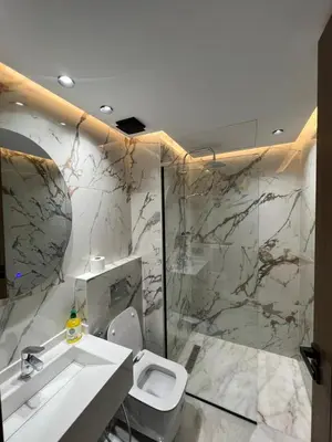 a bathroom with a white toilet and a sink at studio in Maarif