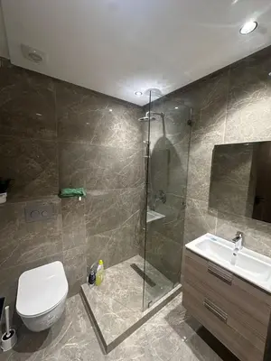 a bathroom with a shower and a toilet and a sink at studio in Maarif