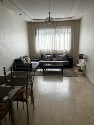 a living room with a couch and a table at Casa Comfort Apartment in Casablanca