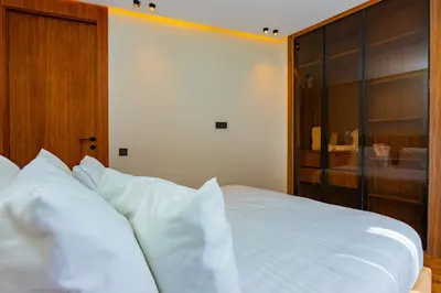 a bedroom with a bed with white pillows at Cozy and new apartment in Princesses in Casablanca