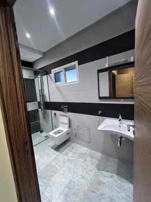 a bathroom with a sink and a toilet at Villa piscine in Temara