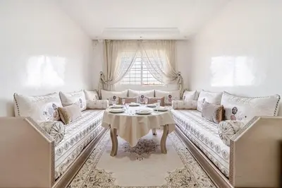 a living room with a couch and a table at Comfort Pool Apartment Heart of Tamaris in Tamaris