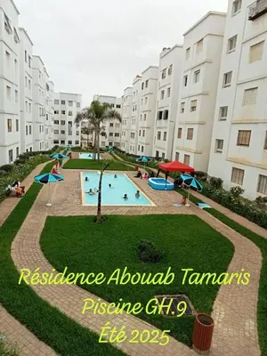 a large swimming pool in front of a building at Comfort Pool Apartment Heart of Tamaris in Tamaris