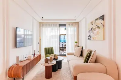 a living room with two couches and a table at Chic Hotel-Style Apartment in Casablanca in Casablanca