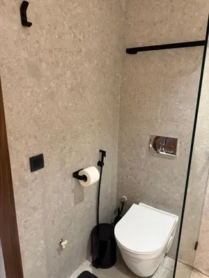 a bathroom with a toilet and a toilet paper dispenser at Studio Best in Casablanca in Casablanca