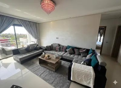 a living room with a couch and a table at Beachside Charming Apartment in Tamaris