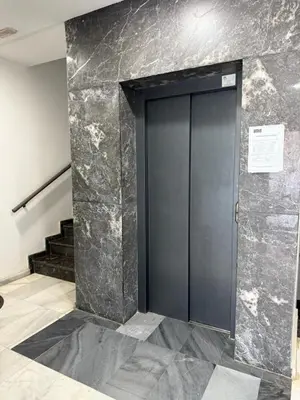 a door in a room with a staircase and a wall at Luxury Stay in Prestigia Golf City in Bouskoura