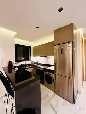 a kitchen with a stainless steel refrigerator and a counter at Modern studio in Casablanca in Casablanca
