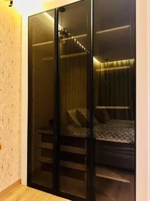 a glass closet with a bed inside of it at Modern studio in Casablanca in Casablanca