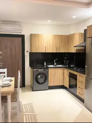 a kitchen with a stove and a dishwasher in it at Apartment with large terrace Mohammedia in Mohammedia